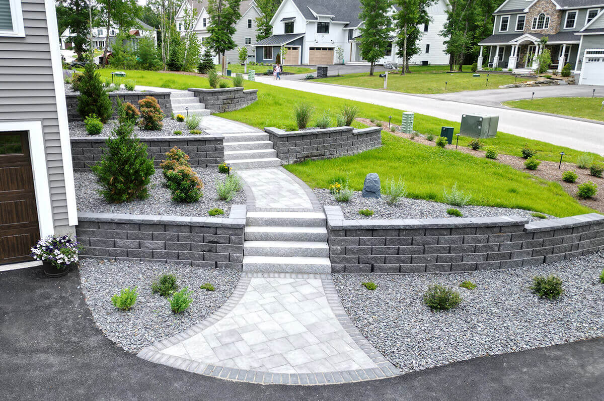 Bi-level stone walkways with retaining walls on both sides