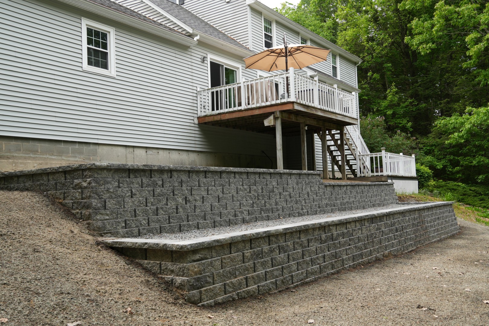 tiered retaining wall supporting a deck