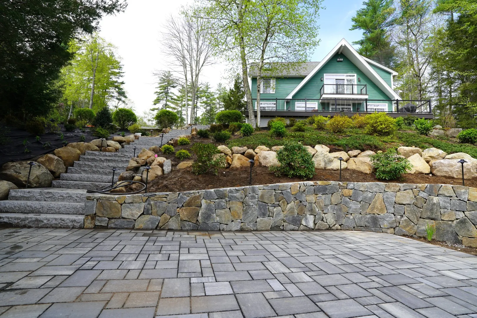 Stone wall and paver patio