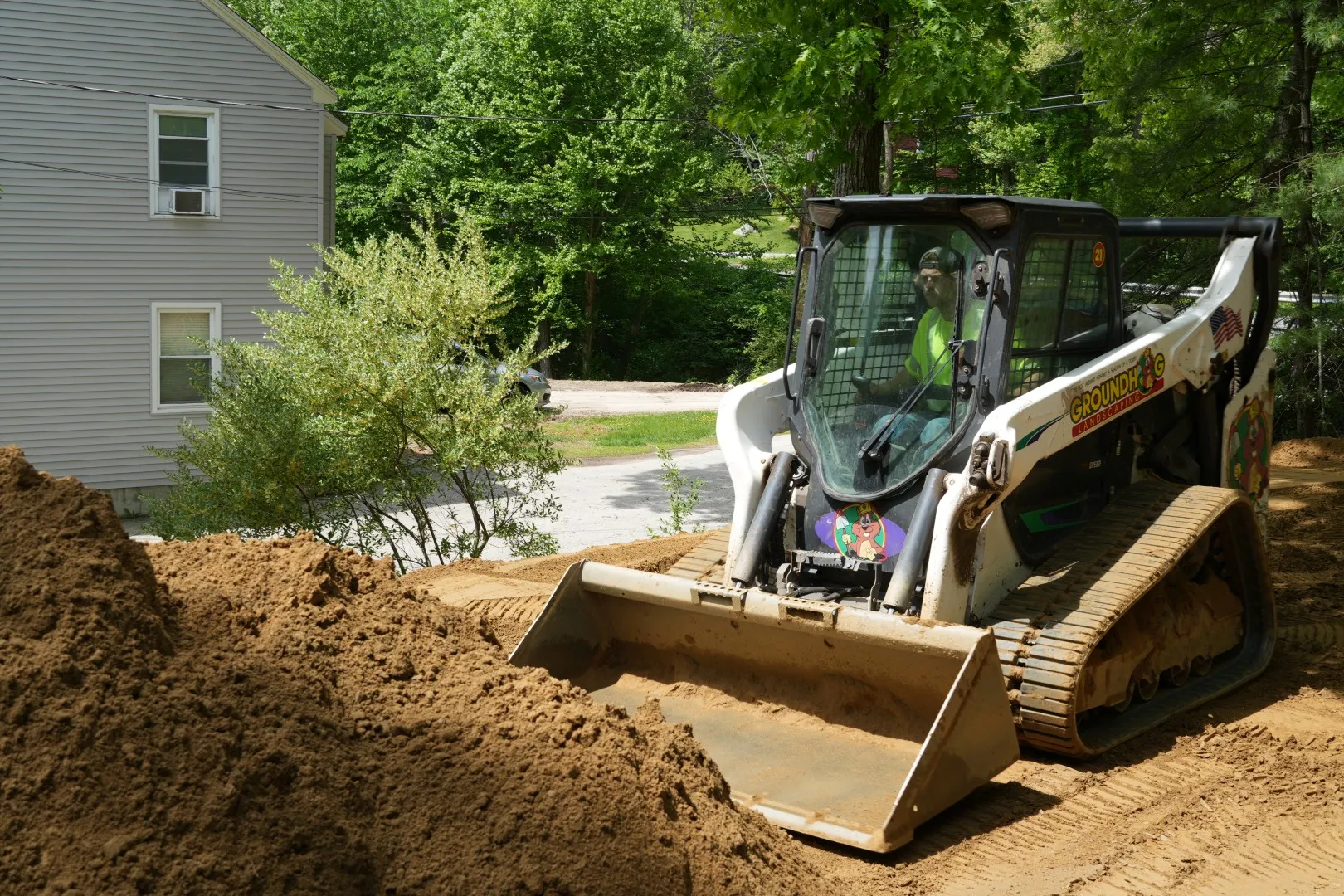 loader spreading loam